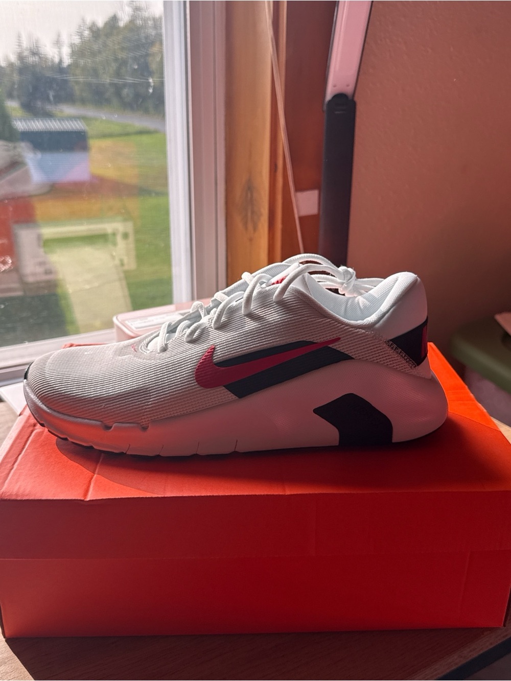 Unisex Nike White Sneakers with red Swoosh and black Accents